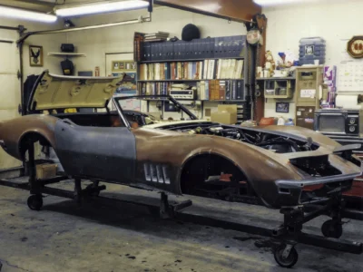 1969 Corvette Stingray body in primer showing rear quarter and door area at Corvette Connection