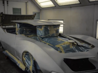 1969 Corvette Stingray body masked and ready for final red paint in paint booth