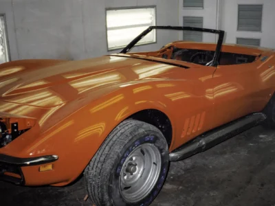 Completed 1969 Corvette Stingray convertible in red during final assembly at Corvette Connection
