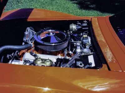 Restored engine bay with chrome air cleaner in completed 1969 Corvette Stingray at car show