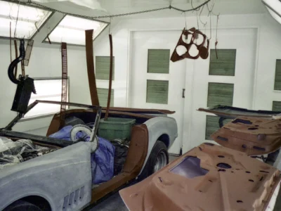 1969 Corvette body panels and interior area in primer during restoration.