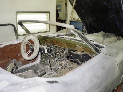 White 1969 Corvette interior and dashboard area stripped for restoration.