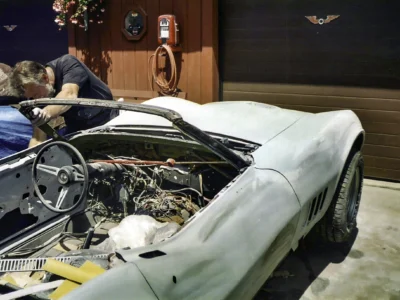 1969 Corvette engine bay and front body area during assembly and bodywork.