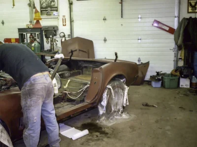 Brown 1969 Corvette body shell inside the shop during restoration.