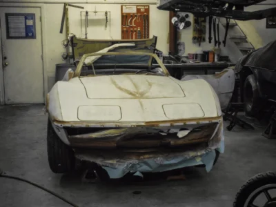 1969 Corvette Stingray convertible body in primer showing hood and fender lines