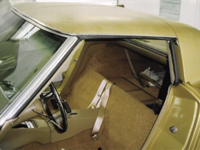 Gold 1969 Corvette interior with tan seats and trim during reassembly.