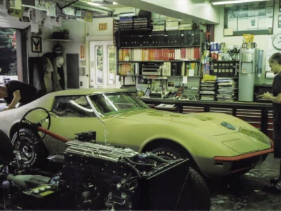 Gold 1969 Corvette parked inside Corvette Connection during final assembly.
