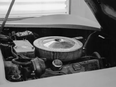 Black-and-white close-up of 1969 Corvette engine bay with air cleaner.