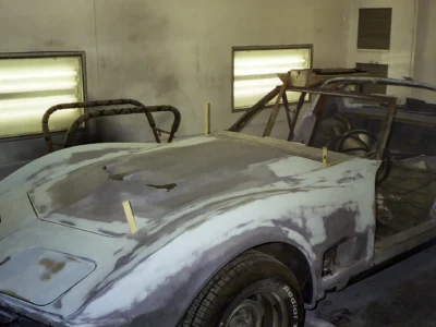 1970 Corvette body with sanding and filler work along the front fender.