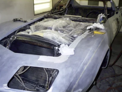 1970 Corvette windshield and roof opening masked during bodywork.