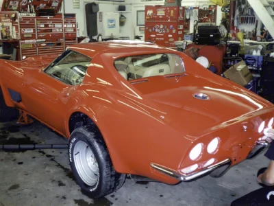 Red 1970 Corvette in the shop after paint and body restoration.