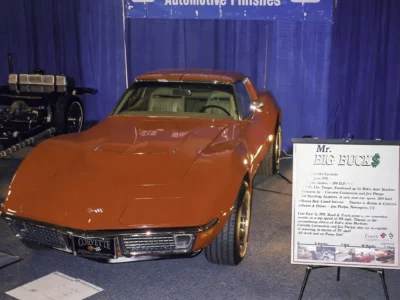 Front view of finished red 1970 Corvette displayed indoors at a car event.