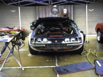 McBurnie Daytona Spyder with hood open showing engine bay under carport at Corvette Connection