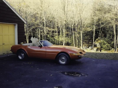 McBurnie Daytona Spyder replica in red rear three-quarter view outdoors at Corvette Connection
