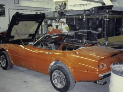 C3 Corvette donor car with engine exposed during teardown for McBurnie conversion