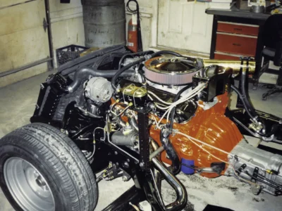 McBurnie Daytona Spyder 350 V8 engine with orange block and chrome accessories at Corvette Connection