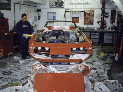 McBurnie Daytona Spyder rear end in red paint with masking during paint process at Corvette Connection