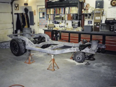 McBurnie Daytona Spyder C3 frame on jack stands during chassis assembly at Corvette Connection