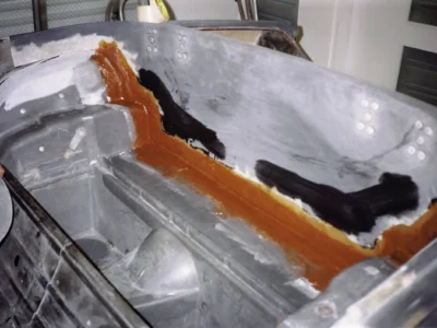 McBurnie Daytona Spyder interior showing fiberglass repair with orange primer areas