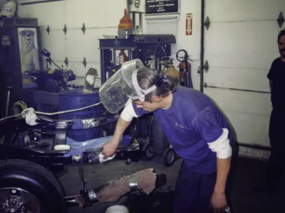 Technician working on McBurnie Daytona Spyder engine bay during build at Corvette Connection