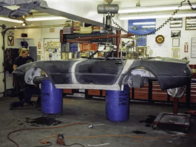 McBurnie Daytona Spyder body being fitted to C3 chassis in shop at Corvette Connection