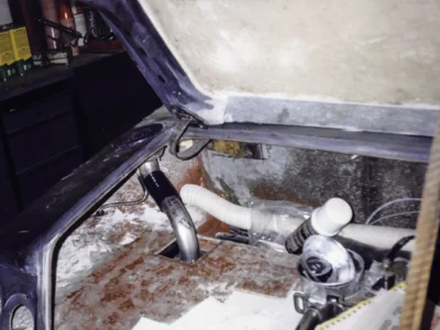 Technician fitting McBurnie Daytona Spyder headlight area and front fender at Corvette Connection