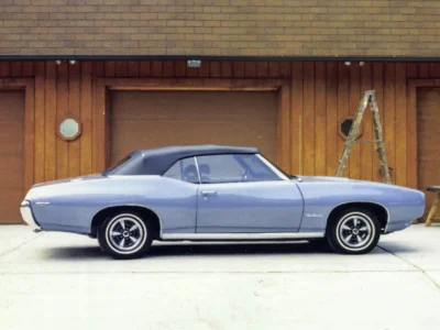 Remastered photo of a blue 1969 Pontiac GTO side profile photographed outside Corvette Connection in Bolton, Connecticut.