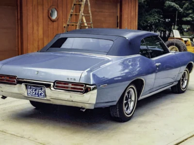 Remastered photo of a blue 1969 Pontiac GTO rear angle photographed outside Corvette Connection in Bolton, Connecticut.