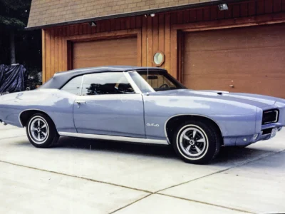 Remastered photo of a blue 1969 Pontiac GTO rear angle photographed outside Corvette Connection in Bolton, Connecticut.