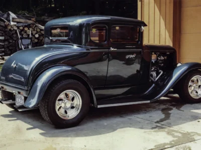 Remastered photo of a blue classic hot rod coupe side profile photographed by Corvette Connection in Bolton, Connecticut.