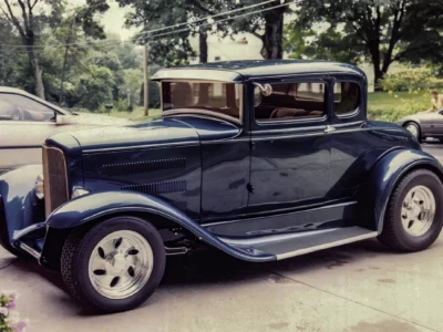 Remastered photo of a blue classic hot rod coupe side view photographed by Corvette Connection in Bolton, Connecticut.