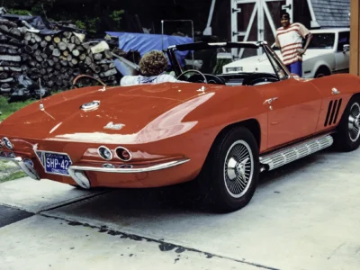 Remastered photo of a red 1965 Chevrolet Corvette convertible rear angle restored by Corvette Connection in Bolton, Connecticut.