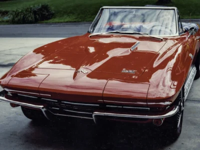 Remastered photo of a red 1965 Chevrolet Corvette convertible front hood detail restored by Corvette Connection in Bolton, Connecticut.