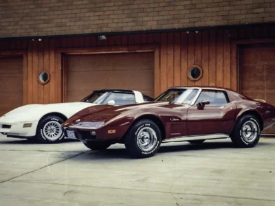 Remastered photo of two classic Chevrolet Corvettes parked outside a restoration shop at Corvette Connection in Bolton, Connecticut.