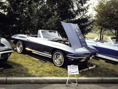 Remastered photo of black and blue classic Chevrolet Corvette convertibles displayed together at a local car show by Corvette Connection in Bolton, Connecticut.
