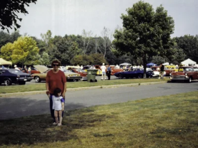 Remastered photo of a Corvette Connection local car show display with classic Corvettes and spectators in the background in Bolton, Connecticut.