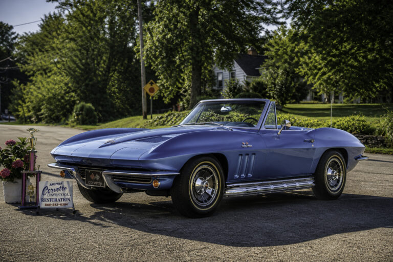 Enhanced original photo of a blue classic Chevrolet Corvette convertible displayed outdoors by Corvette Connection in Bolton, Connecticut.