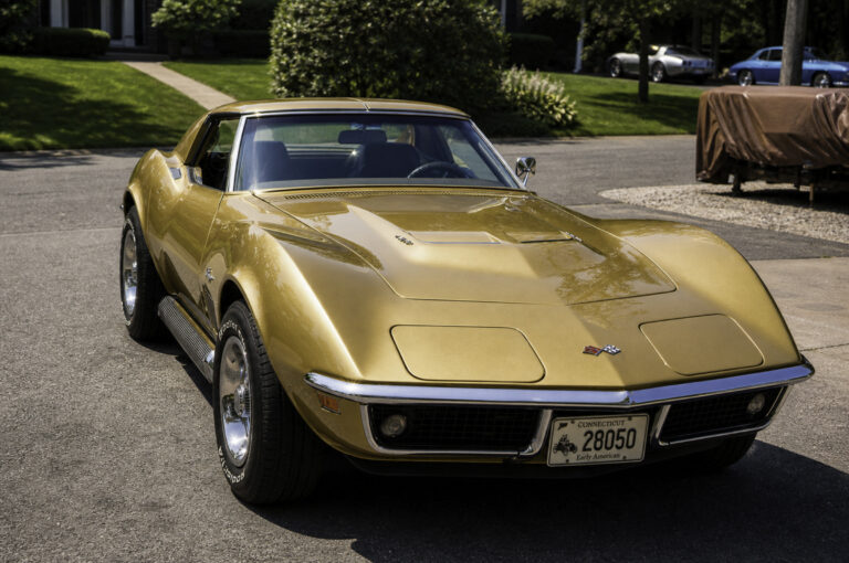 Enhanced original photo of a gold classic Chevrolet Corvette front view restored by Corvette Connection in Bolton, Connecticut.