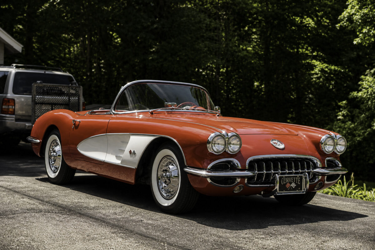 Enhanced original photo of a red and white classic Chevrolet Corvette convertible restored by Corvette Connection in Bolton, Connecticut.