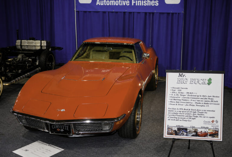 Enhanced original photo of a red Chevrolet Corvette displayed at an automotive show after restoration by Corvette Connection in Bolton, Connecticut.