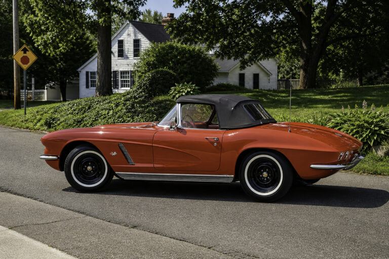 AI-remastered red classic Chevrolet Corvette convertible side view photographed outdoors by Corvette Connection in Bolton, Connecticut.