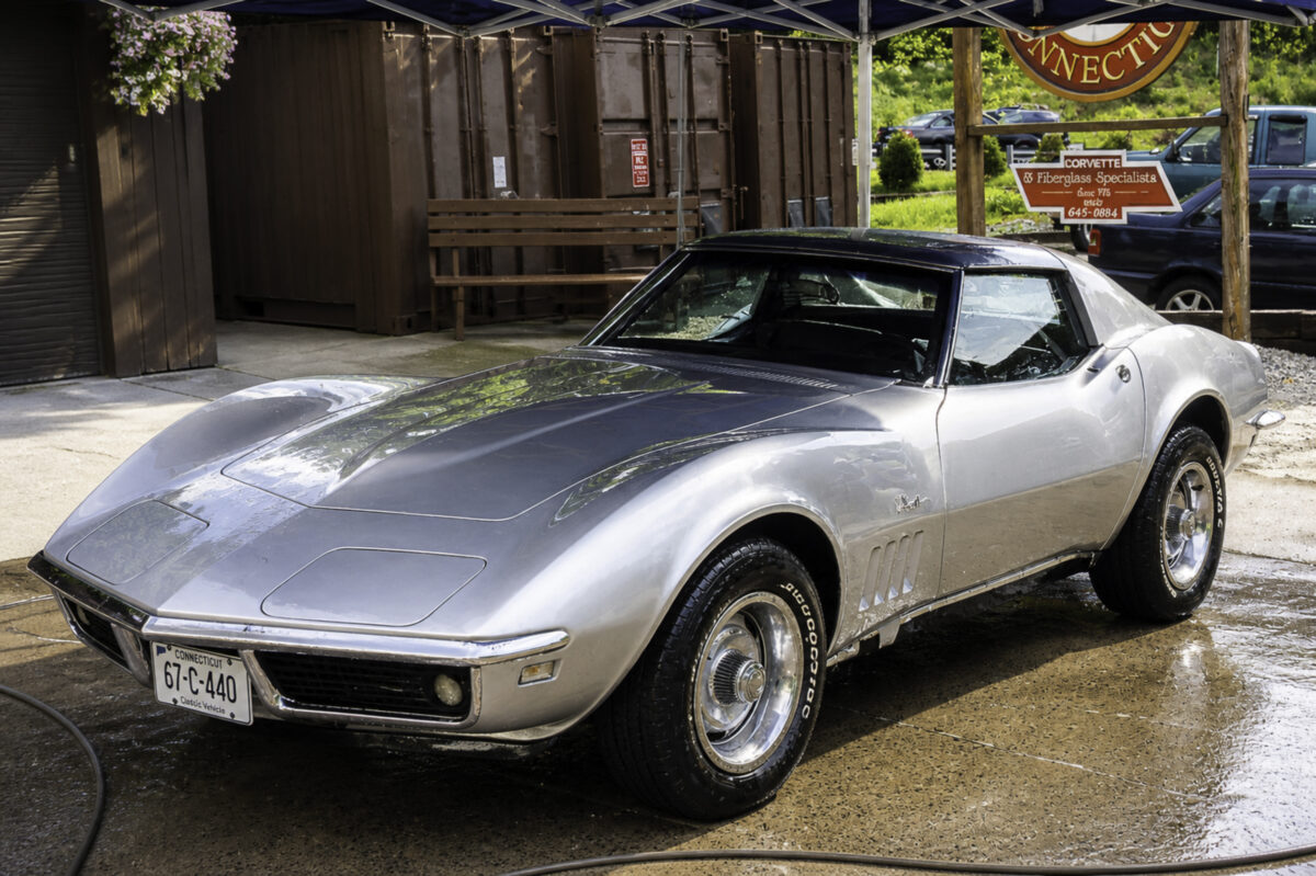 AI-remastered silver classic Chevrolet Corvette front angle photographed outdoors by Corvette Connection in Bolton, Connecticut.