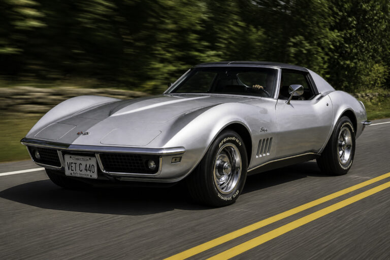 AI-remastered silver classic Chevrolet Corvette driving on the road after restoration by Corvette Connection in Bolton, Connecticut.